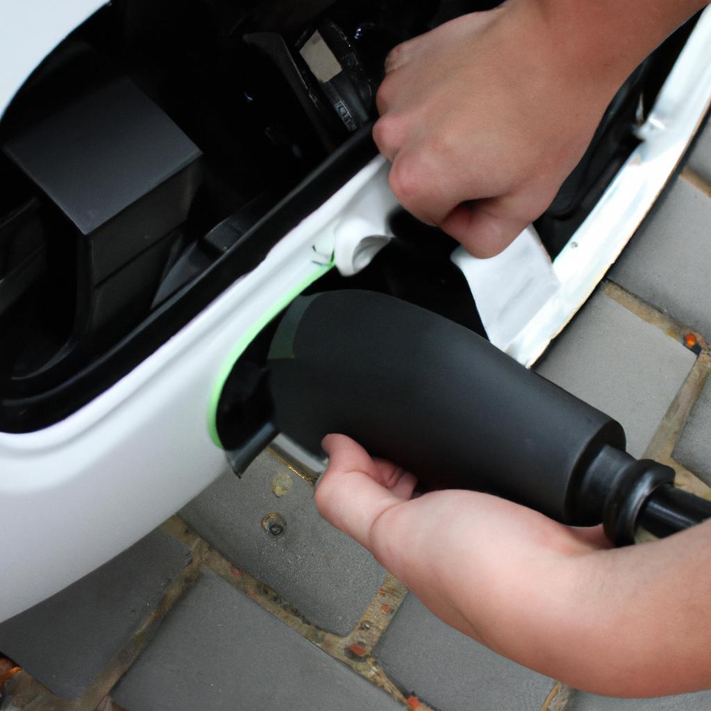 Person installing electric vehicle charger